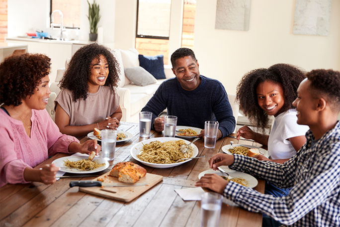 Happy family eating dinner